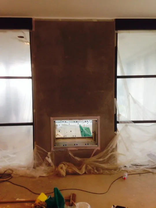 Plastered chimney breast in a lounge, Surrey