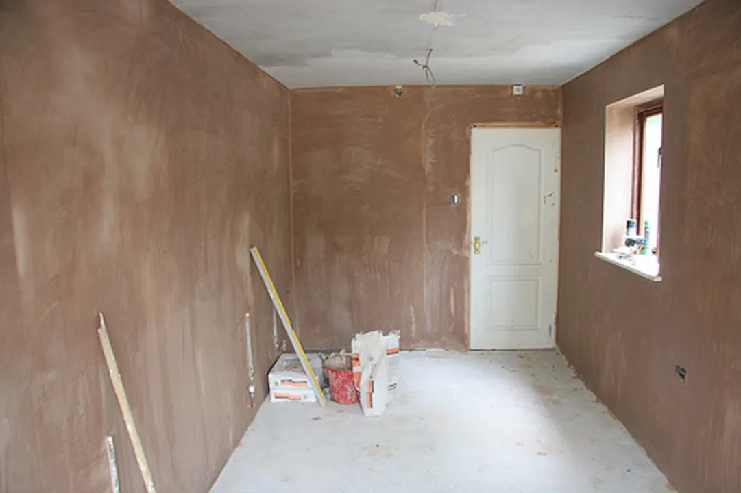 Lounge with freshly skimmed walls ready for decorating, Dorking